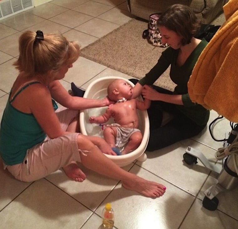 Salchert's daughter, Johanna, 22, helps her bathe Charlie.