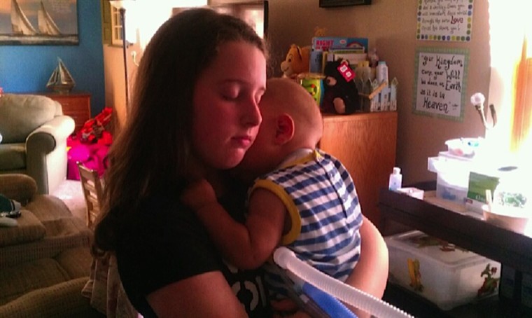 Salchert's daughter, Emily, 14, holds Charlie.