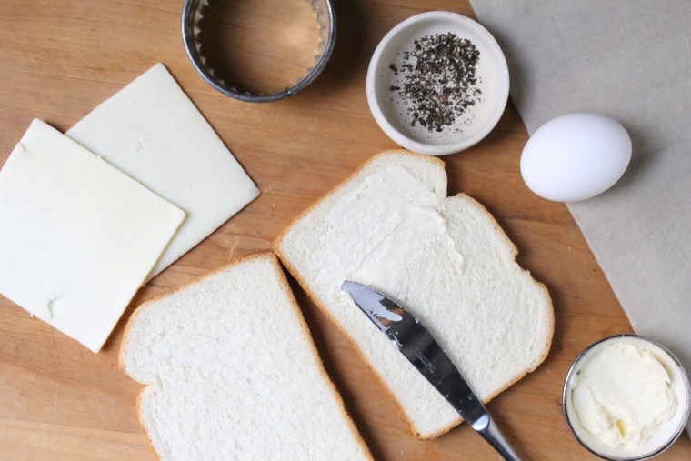 Grilled Cheese Egg-in-a-Hole: Spread 1 teaspoon of butter on each bread slice