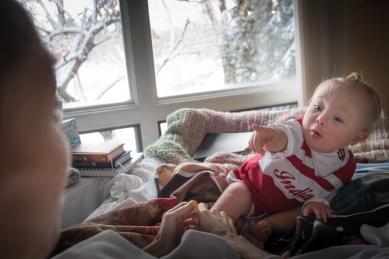 Joey and Indy feek playing on the bed.