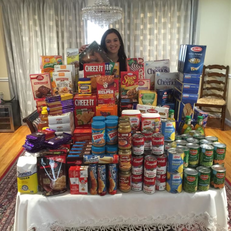 Hannah Steinberg clips coupons to help donate items to charities