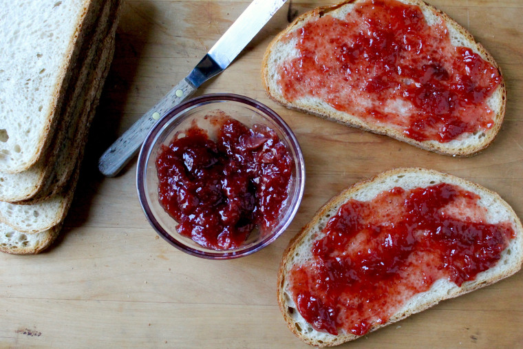 Stuffed French Toast Casserole: On a cutting board, spread the jam between the bread slices