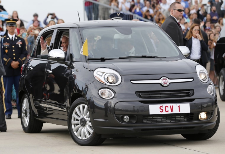 Image: Pope Francis is driven away in the Fiat 500 at Joint Base Andrews outside Washington on Sept 22.