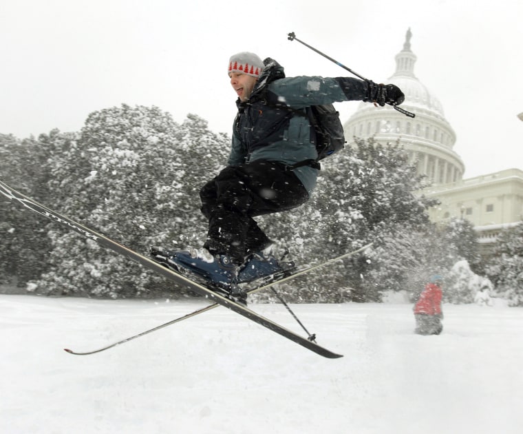 Andrew Kermick, who works on Capitol Hill, goes airborne as he skis in the snow on the West Front of the U.S. Capitol on Dec. 19, 2009.