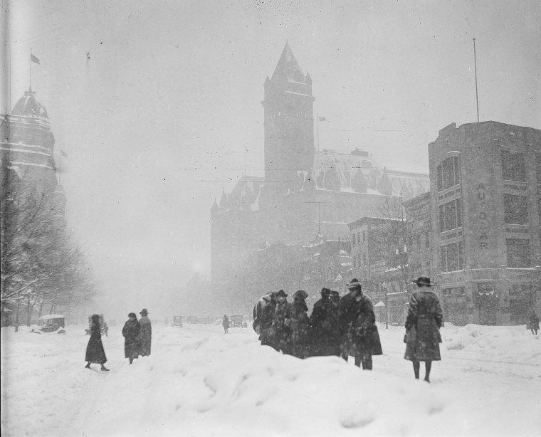 The storm, known as Knickerbocker Snowstorm, caused the roof of Crandall’s Knickerbocker Theatre to collapse, killing 98 people and injuring 133 at the time. Above, people walk on the street in January, 1922 in Washington.