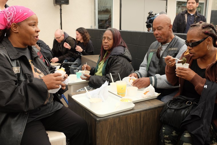 From left: Monique Fields, 47, of Watts; Larry Glaze, 66, of Compton, and Cynthia Simpson, 58, of Compton, eat at Locol in Watts during the restaurant's grand opening.