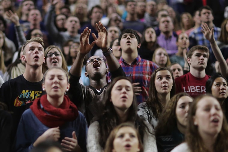 Image: Donald Trump supporters sing Christian songs before the Republican presidential candidate delivers the convocation