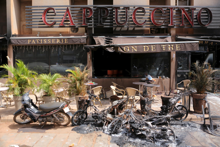 Image: The burned-out exterior of \"Cappuccino\" restaurant is seen in Ouagadougou