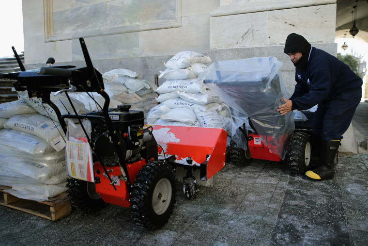Image: A Stone covers gas powered snow sweepers in plastic bags