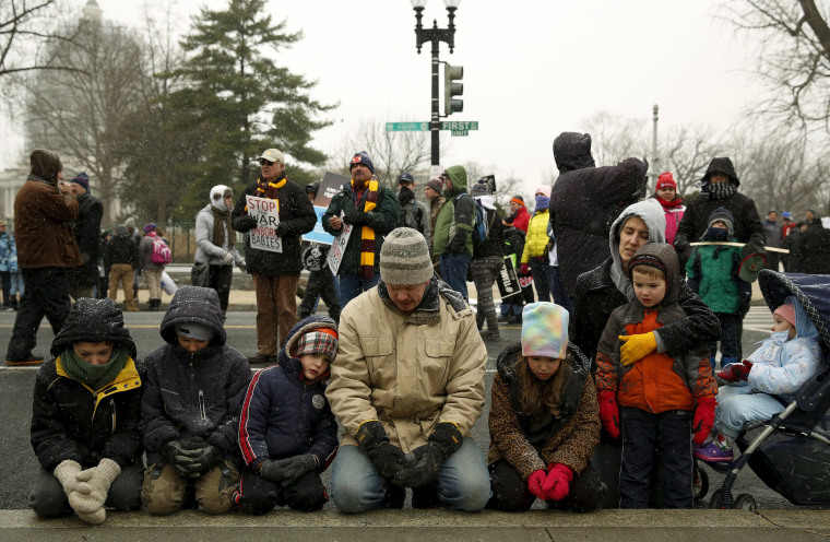 Image: DiIulio family from Fairfield, Pennsylvania prays in front of Supreme Court in Washington