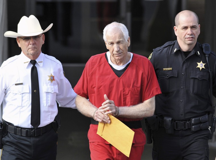 Image: File photo of Jerry Sandusky leaving the Centre County Courthouse after his sentencing in his child sex abuse case in Bellefonte