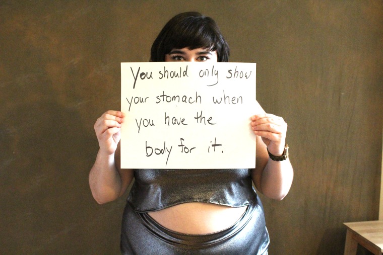 A woman who was told to avoid belly-baring looks fights back in this campaign photo.