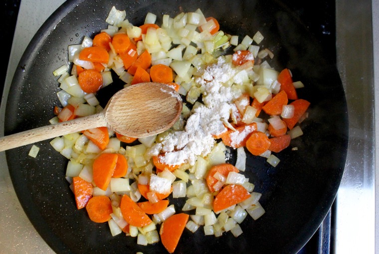 Slow Cooker Chicken and Biscuit Pot Pie: Cook the onion and carrot until just softened, then add the flour