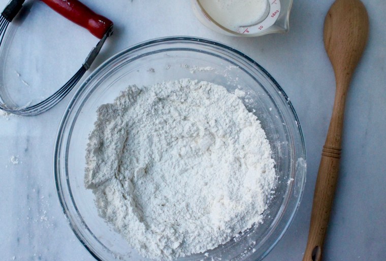 Slow Cooker Chicken and Biscuit Pot Pie: Start making the biscuits by cutting the chilled butter into the flour until it resembles coarse meal