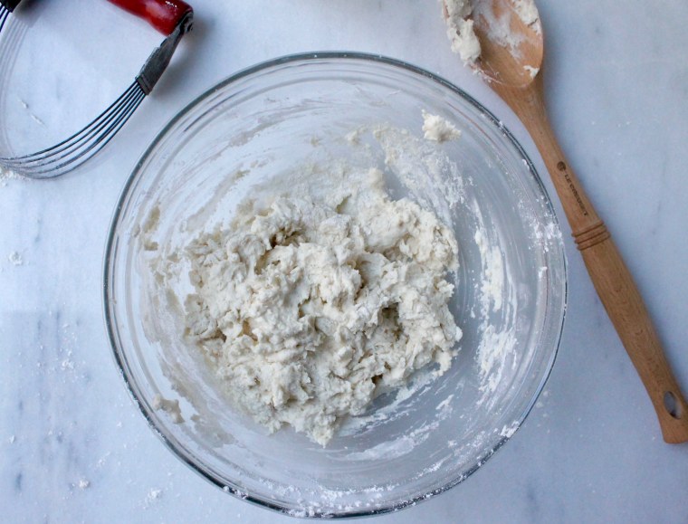 Slow Cooker Chicken and Biscuit Pot Pie: Stir in the milk to form a soft dough for the biscuits