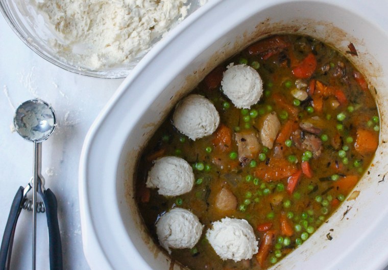 Slow Cooker Chicken and Biscuit Pot Pie: Using an ice cream scoop or spoons, dollop 2–tablespoon mounds of biscuit dough onto the chicken stew