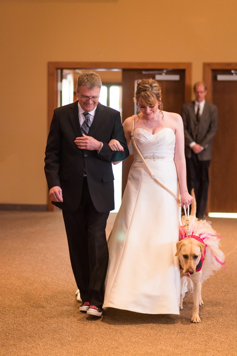 Excl: Service dog Bella calms down bride on wedding day