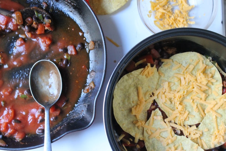 Slow Cooker Huevos Rancheros: Over the tostadas, place a layer of cheese, then a layer of sauce and repeat