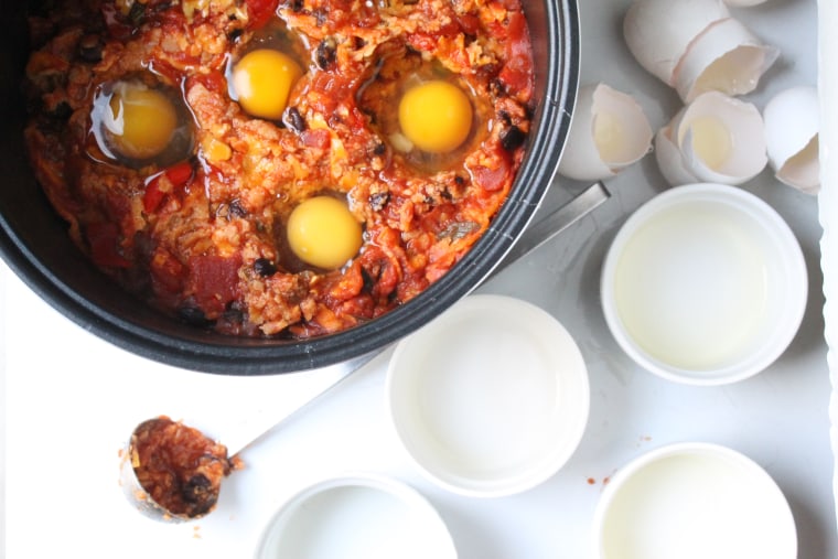 Slow Cooker Huevos Rancheros: After cooking for 3½ hours, using a small ladle or spoon, make 6 deep wells into the casserole and carefully pour the eggs into the wells