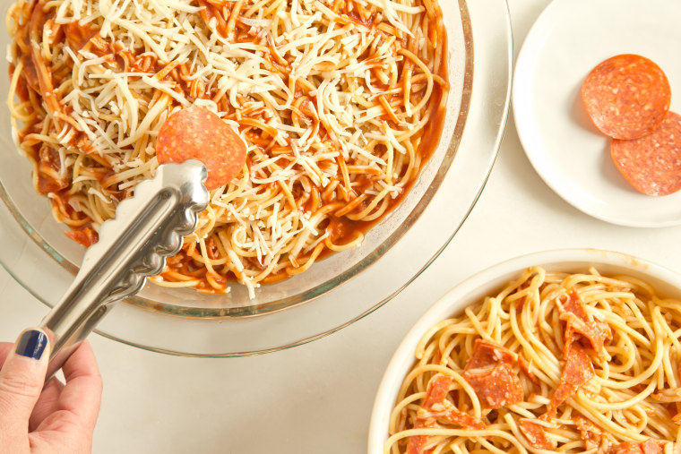 Pizza Spaghetti Pie: Layer the spaghetti, cheese and sauce, then repeat
