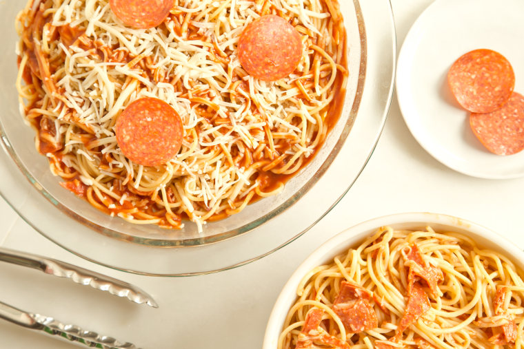 Pizza Spaghetti Pie: Top the pie with the whole pepperoni slices