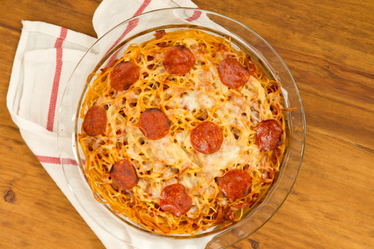 Pizza Spaghetti Pie: Bake until the pie is sizzling around the edges and the top of the pie is golden brown, about 30 minutes