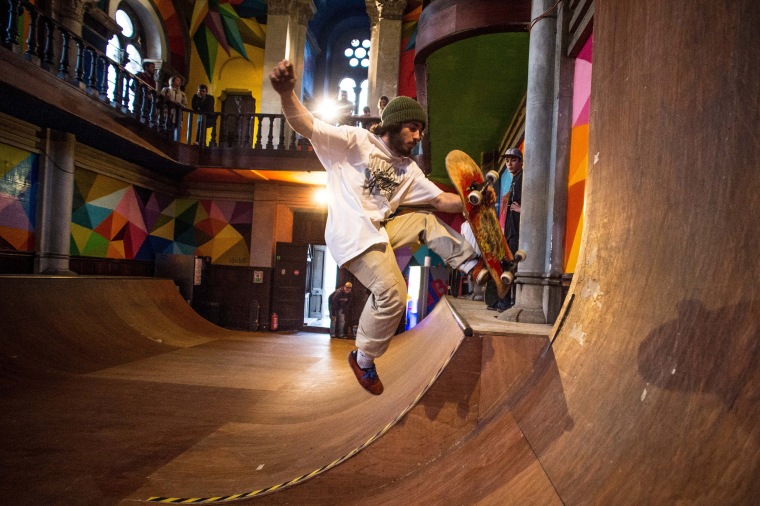 Image: A skater practices in a skate park inside the Santa Barbara church