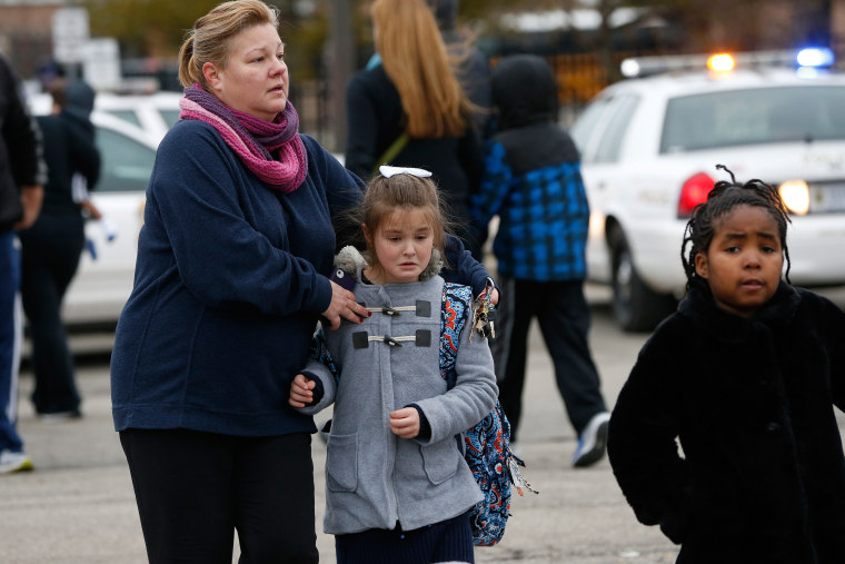Image: Students at Amy Beverland Elementary School are picked up after school after a bus accident