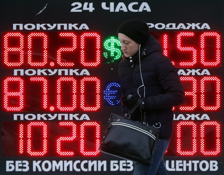 Image: Russian ruble hits record low versus dollar amid falling oil prices