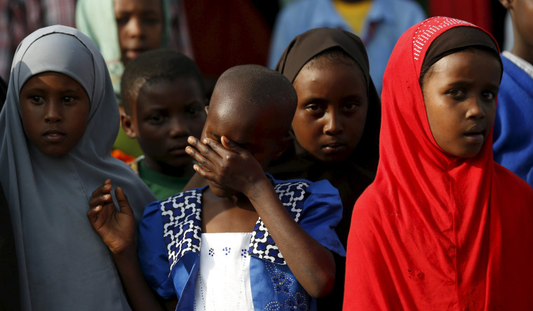Image: Children attend prayers to pay respects to the Kenyan soldiers serving in AMISOM, who were killed in El Adde during an attack