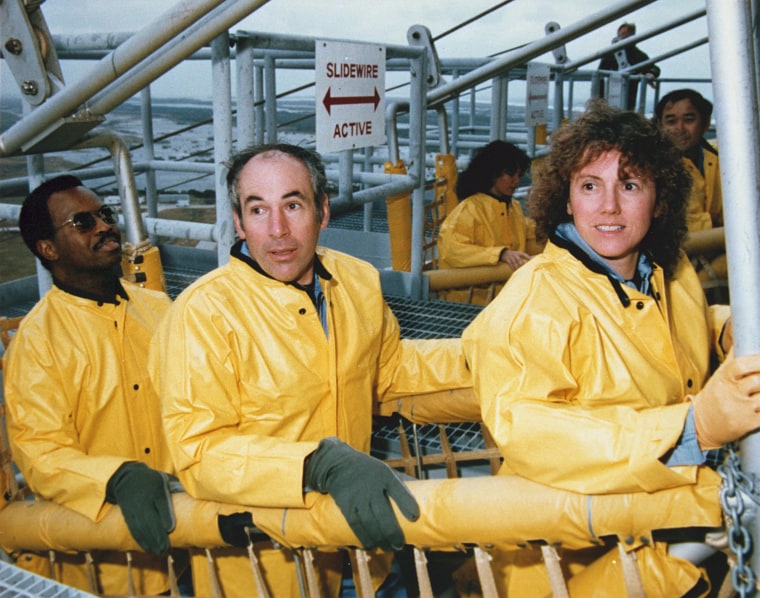 Image: Challenger's crew members practice the procedure for escaping from the launch pad at Kennedy Space Center