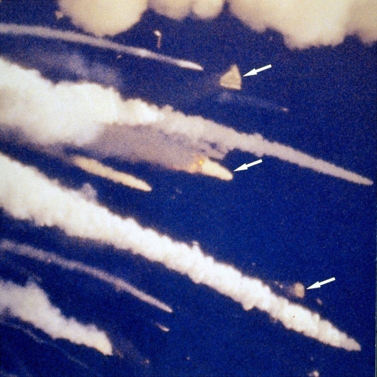 Image: Fragments of the orbiter fly away from the explosion
