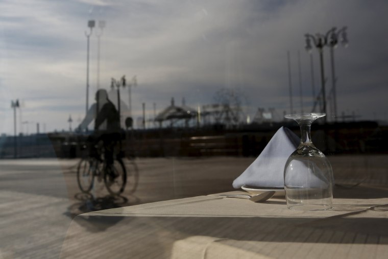 Image: An empty table inside a boardwalk restaurant