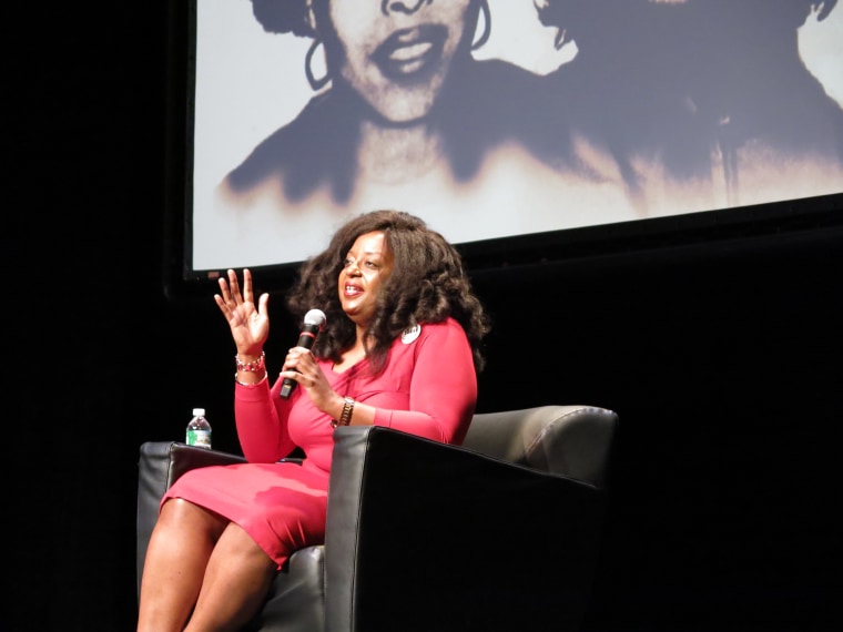 Now a professor at The New School in New York City, Dr. Robin J Hayes talks to the more than 300 audience members at the Schomburg Center about educational opportunities in Cuba.  (Photo By Melissa Noel)