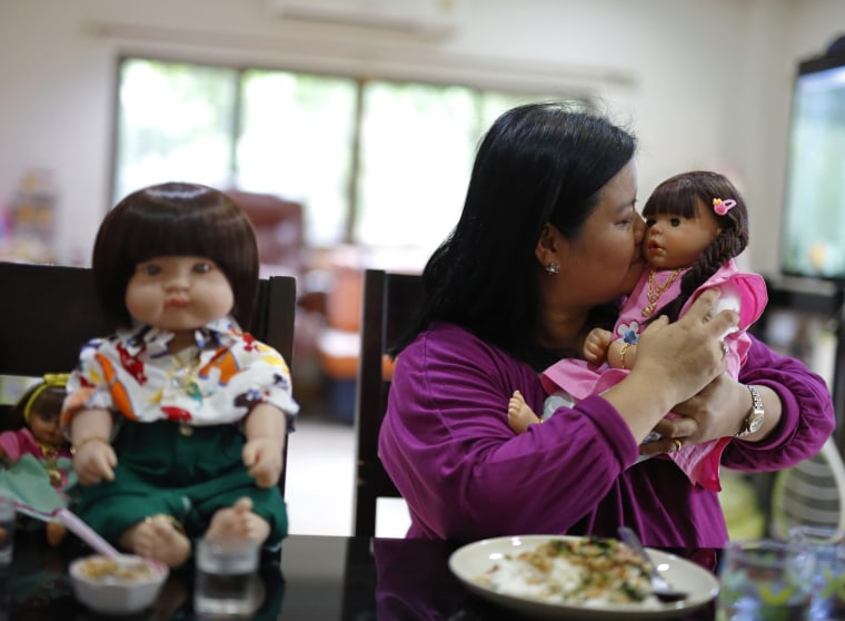 Image: Ratchada Mahanavanont with "child angel" doll