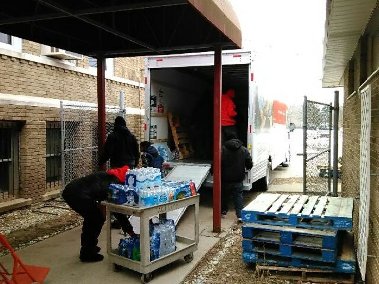 Michigan Muslim Community Council volunteers delivering bottled water in Flint, Michigan.