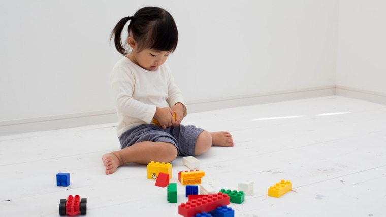 kid having fun with blocks