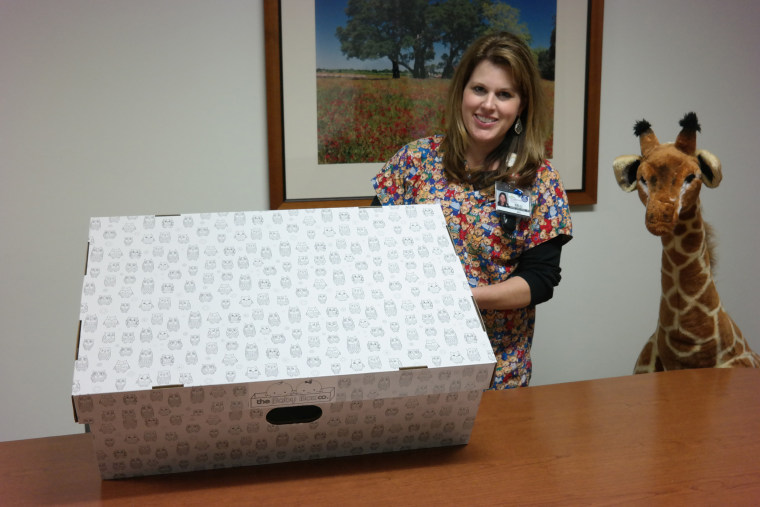 IMAGE: Nurse Kelli Brimagner with a baby box