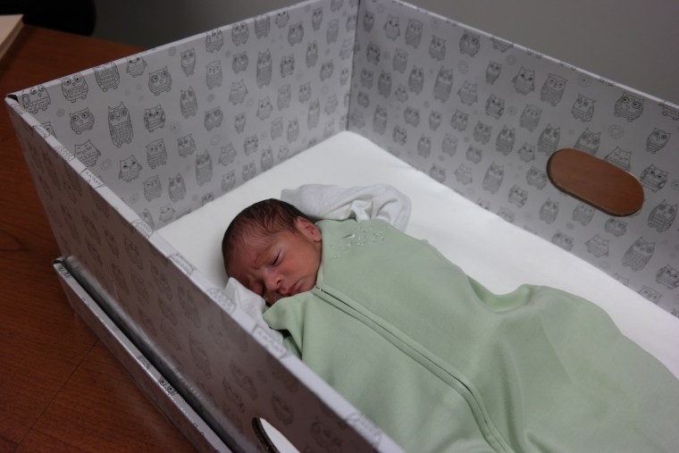 IMAGE: Adrian Delgado in a baby box