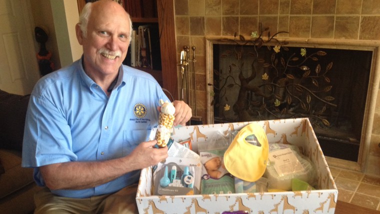 IMAGE: John Chance with baby box