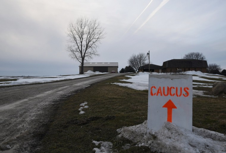 Image: A sign directs Democratic caucus goers to the home of Gary and Mary Weaver in Rippley