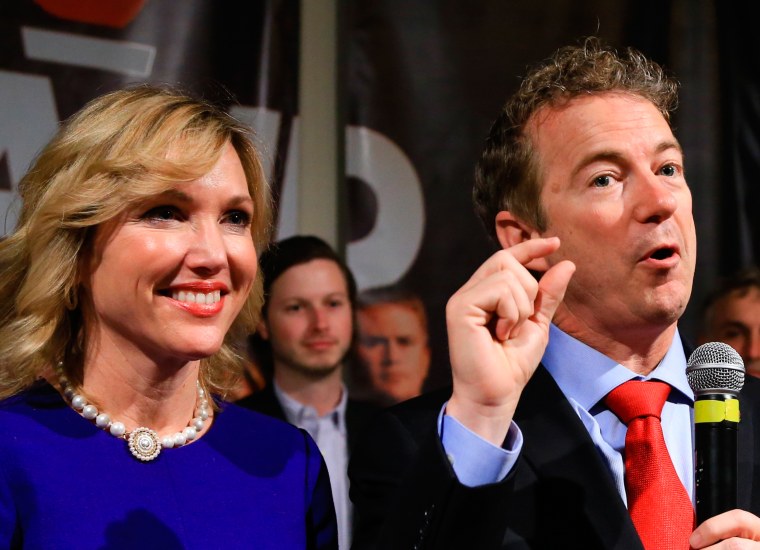 Image:Republican presidential candidate, Sen. Rand Paul, R-Ky, gestures as he speaks to supporters with his wife Kelley