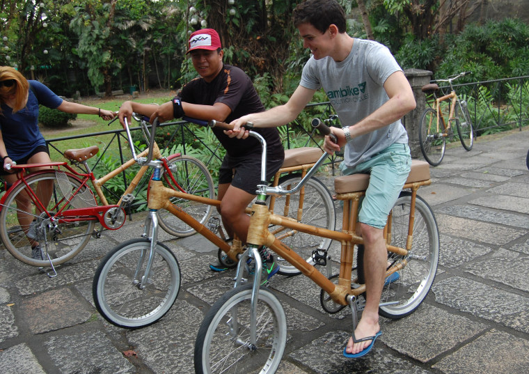 Rey Ballesca (left), Bambike’s tourism manager, guides a group during a bicycle tour of the Intramuros section of Manila, Philippines, on Jan. 19.