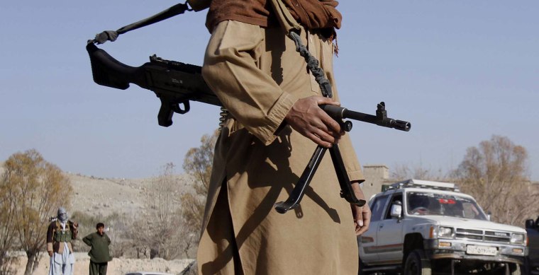 A Taliban fighter mans a checkpoint in Nangarhar province, Afghanistan, in 2010. 