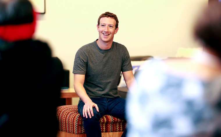 Facebook CEO Mark Zuckerberg laughs with guests at Facebook’s 12th birthday event on Monday, Feb. 1.