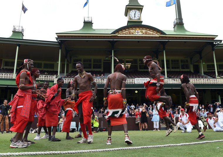 Image: Maasai Warriors from Kenya perform a dance before commencing the cricket match