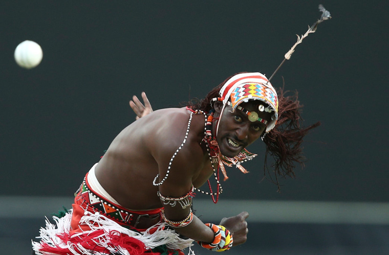 Image: A member of the Maasai Cricket Warriors bowls a ball