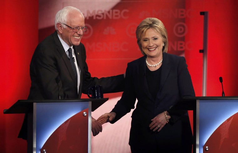 Image: Democratic U.S. presidential candidate Senator Bernie Sanders and former Secretary of State Clinton shake hands at the conclusion of the Democratic presidential candidates debate sponsored by MSNBC at the University of New Hampshire in Durham