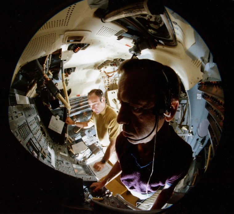 Apollo 14 astronauts in lunar module simulator, July 1970.