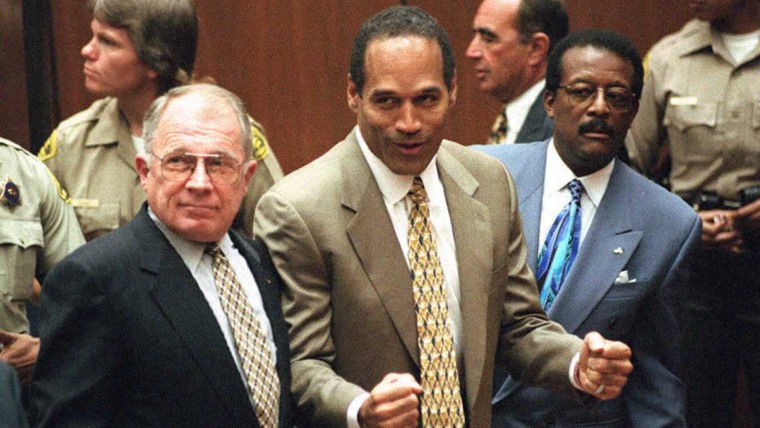 Image: Murder defendant O.J. Simpson (C) listens to the n